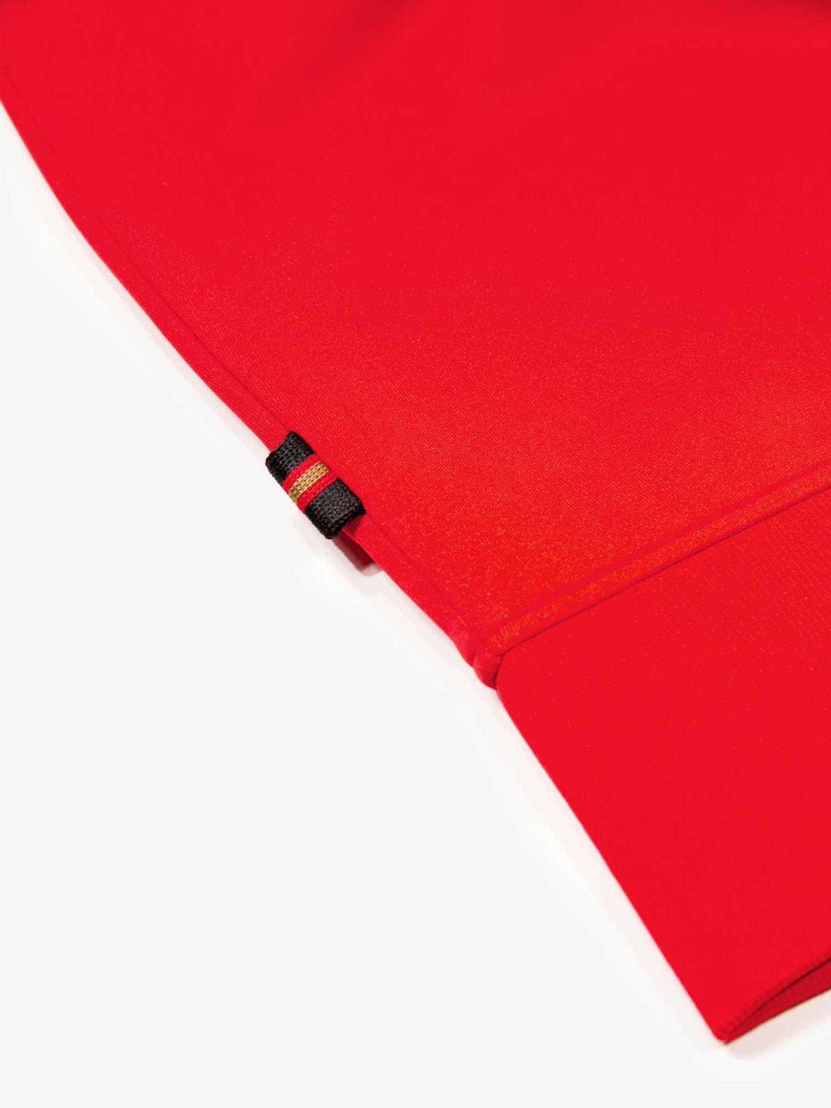 Close-up of rib cuff and hem on red LUKE 1977 Noel tricot sweatshirt