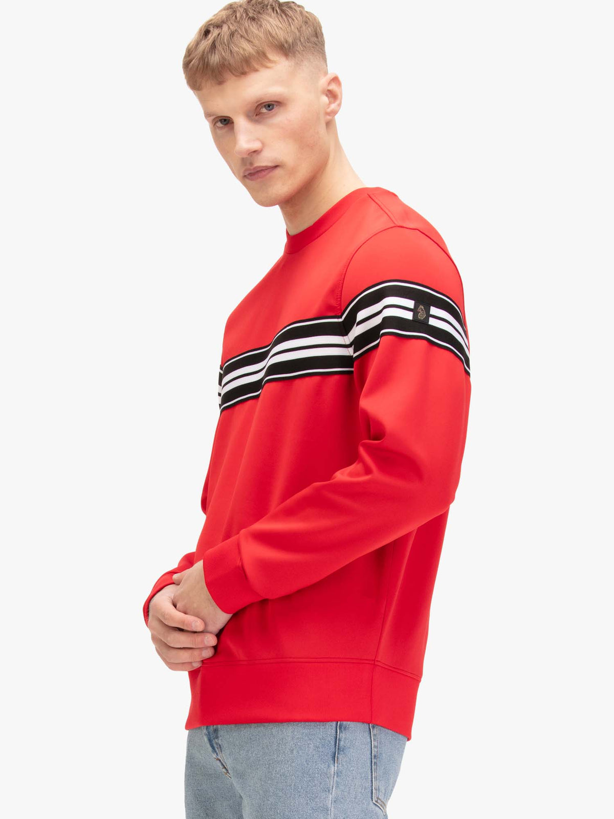 Side view of man wearing red LUKE 1977 Noel crew neck tricot sweatshirt
