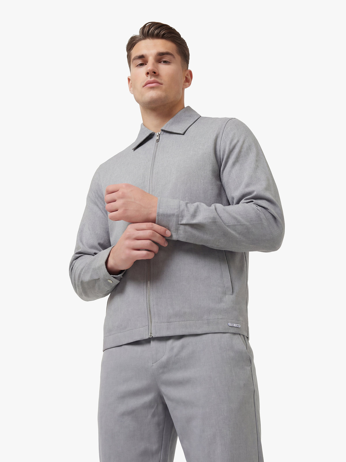 Men's grey jacket with snap-button front, back view