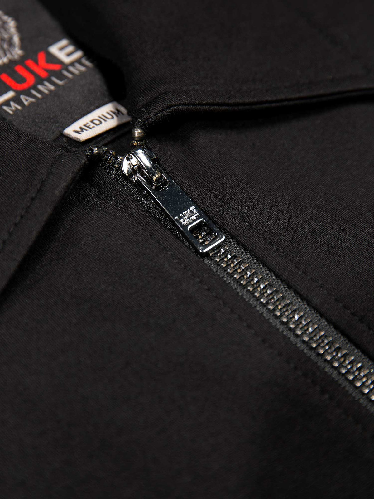 Men's black jacket with snap-button front and front pocket, detail view 2