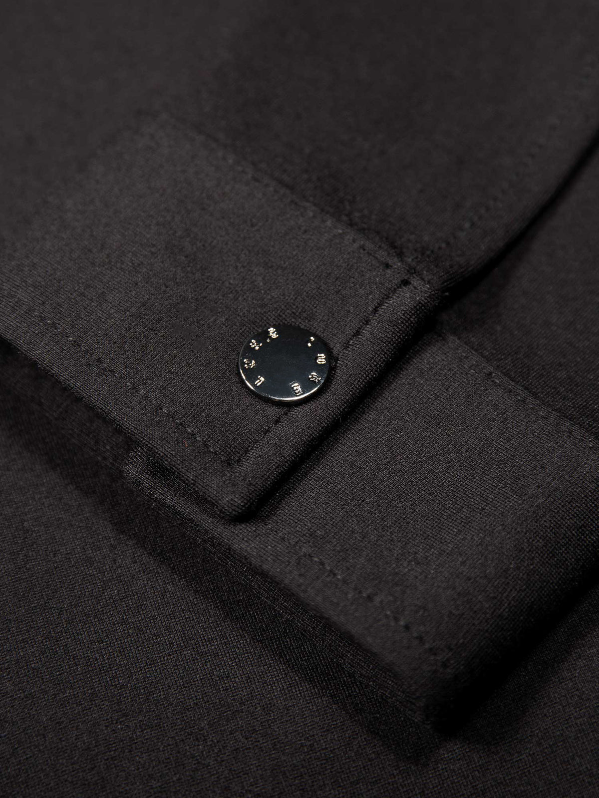 Men's black jacket with snap-button front and front pocket, detail view 4