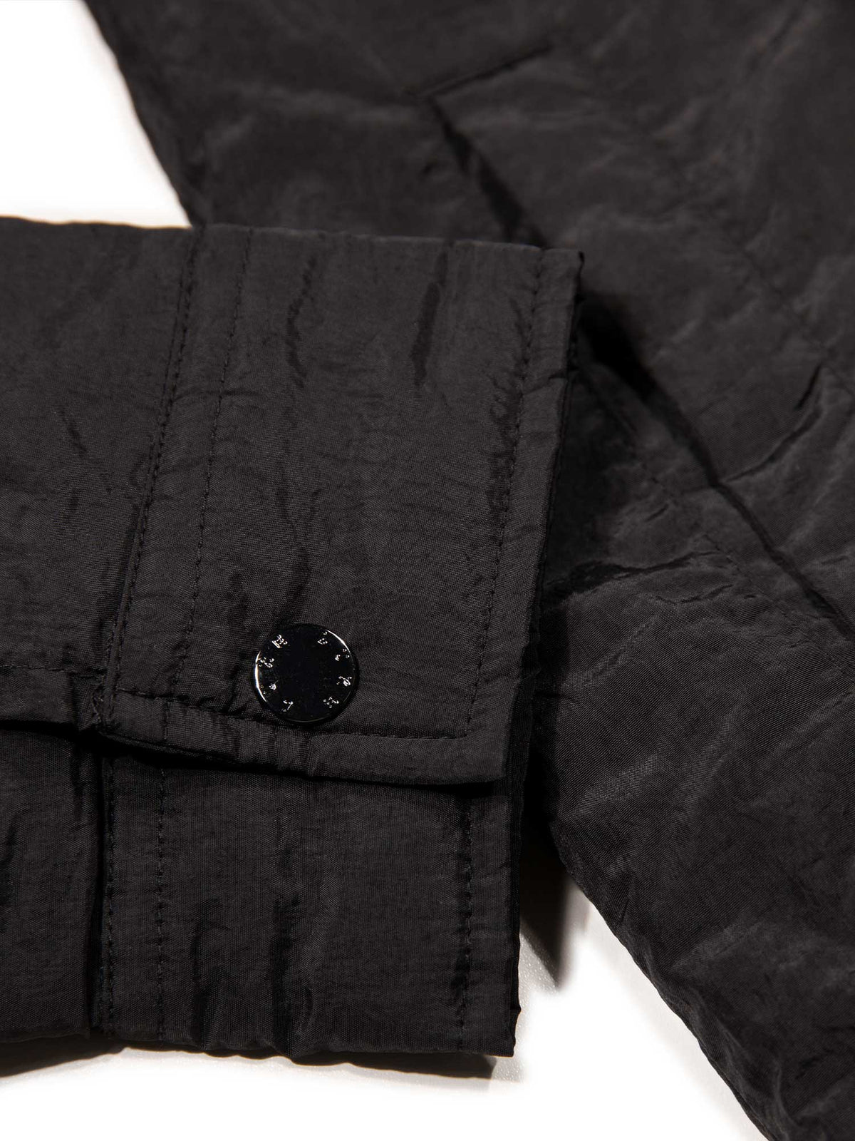 Men's black jacket with button-up front and front pocket, detail view 2
