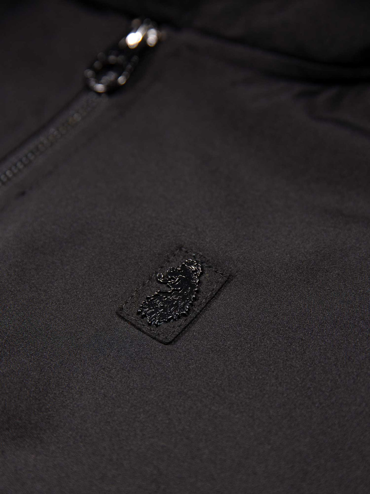 Men's black jacket with zip-up front and front pocket, detail view 3