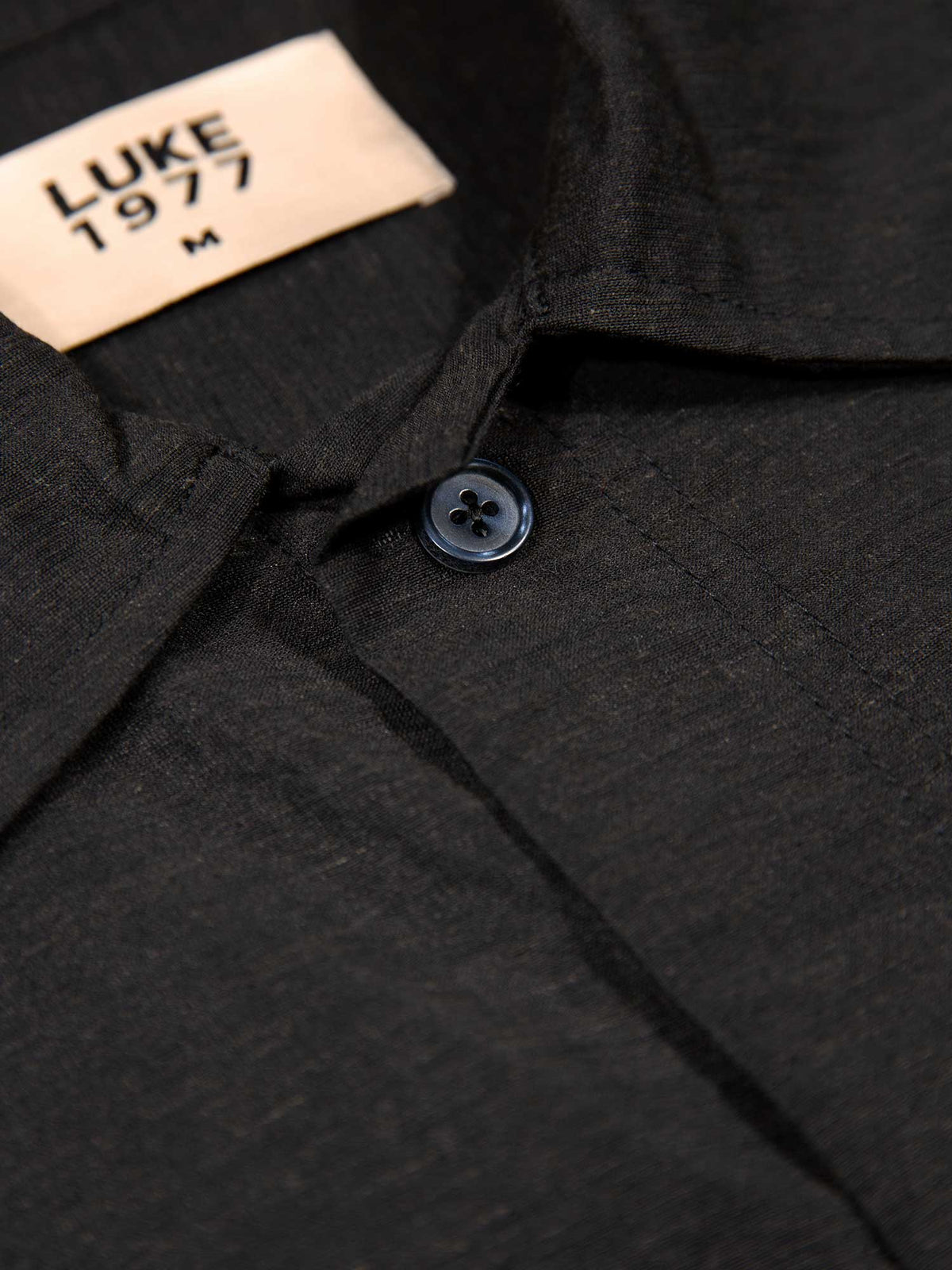 Men's relaxed-fit black shirt with button-up front, detail view 2