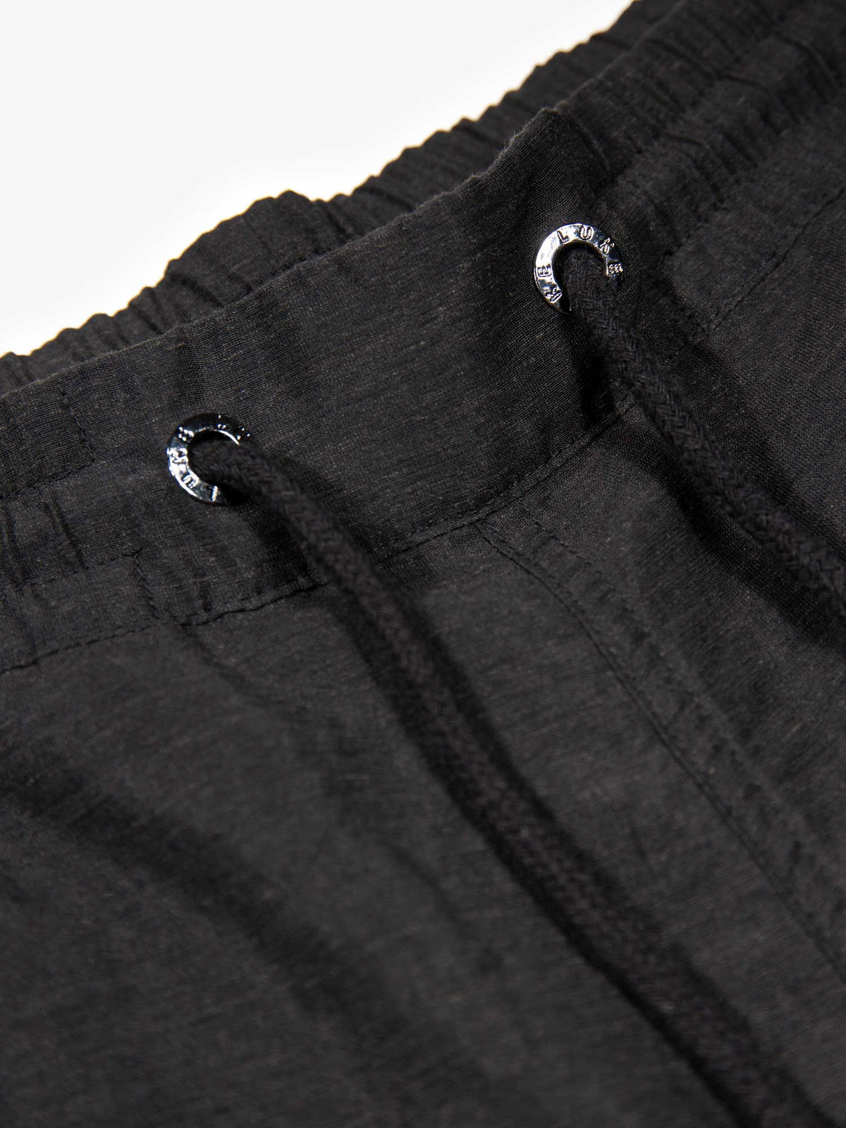 Men's black shorts with drawstring waistband and cargo pockets, detail view 1