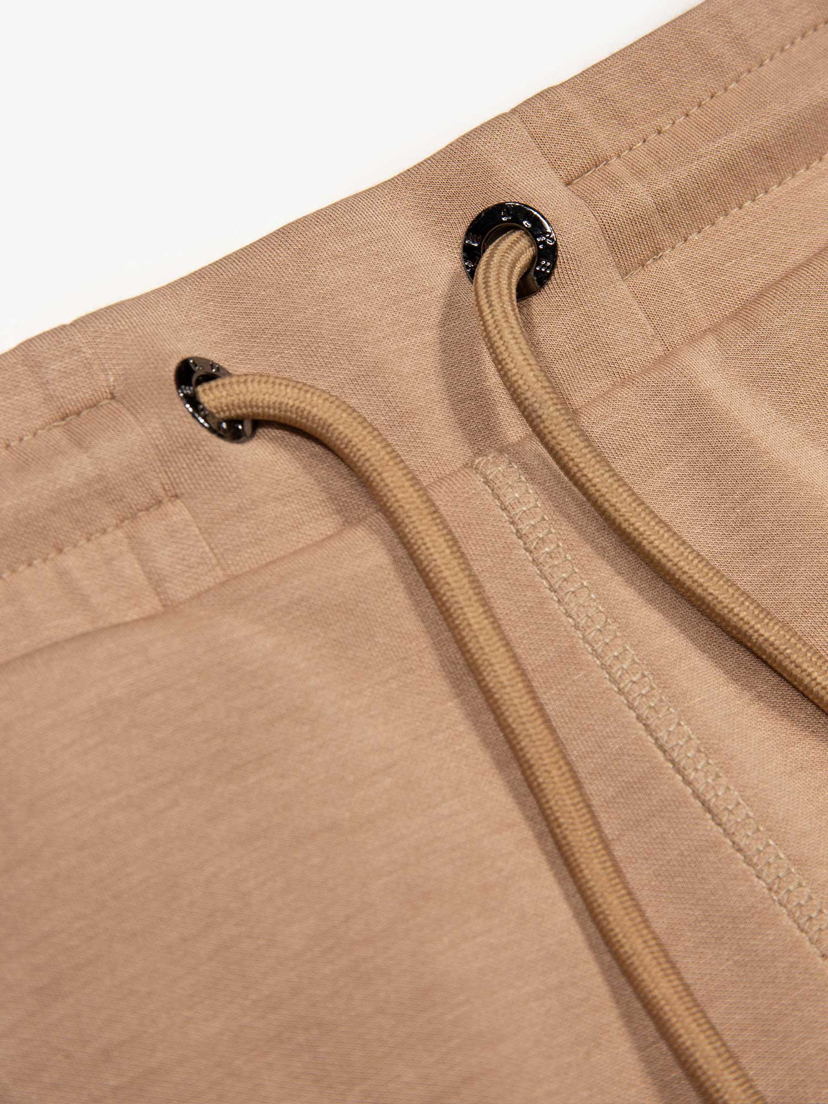 Men's beige shorts with drawstring waistband, detail view 1