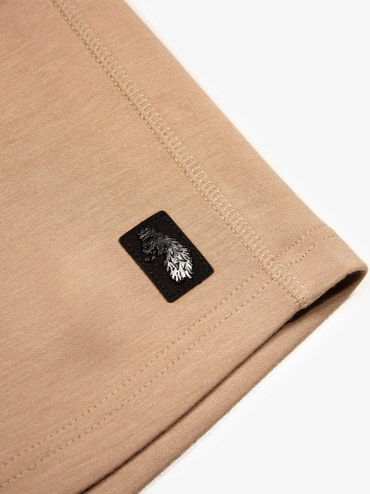 Men's beige shorts with drawstring waistband.
