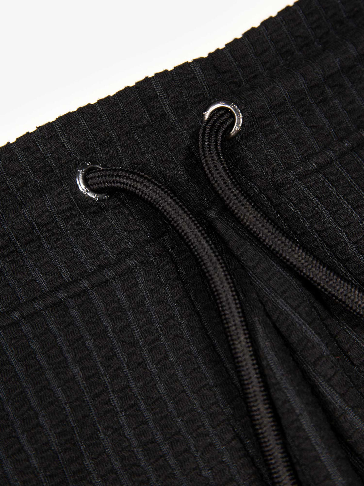 Men's black shorts with drawstring waistband, detail view 1