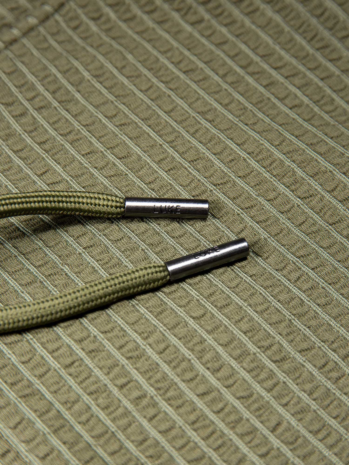 Men's green shorts with drawstring waistband, detail view 2