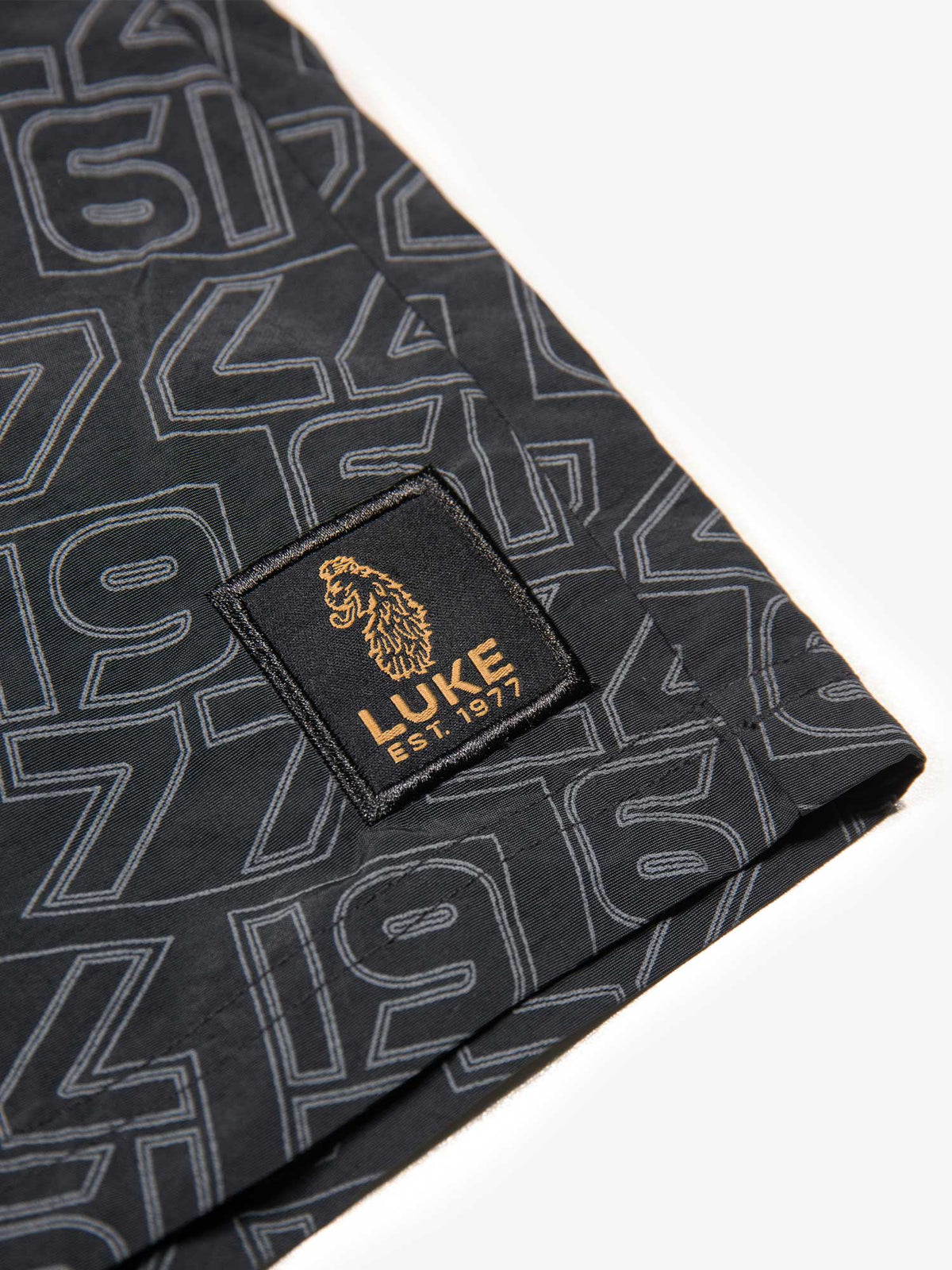 Men's black swim shorts with drawstring waistband, detail view 3