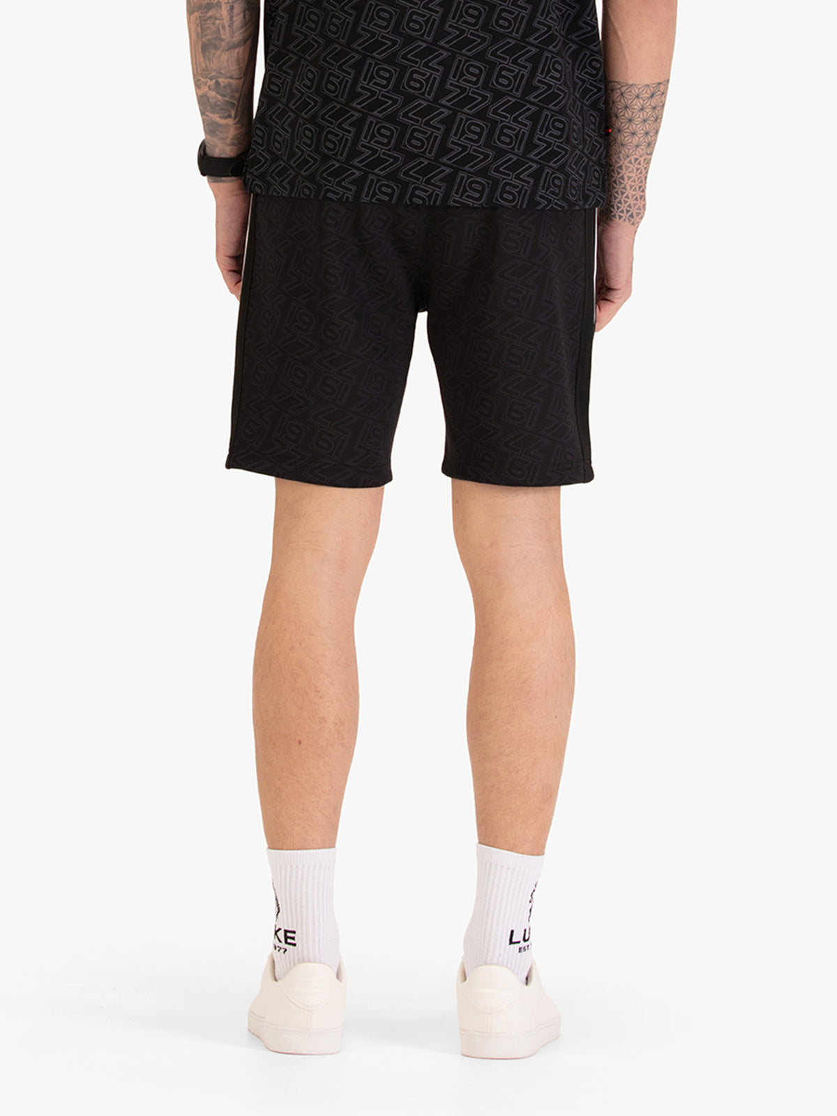 Men's black shorts with drawstring waistband, back view