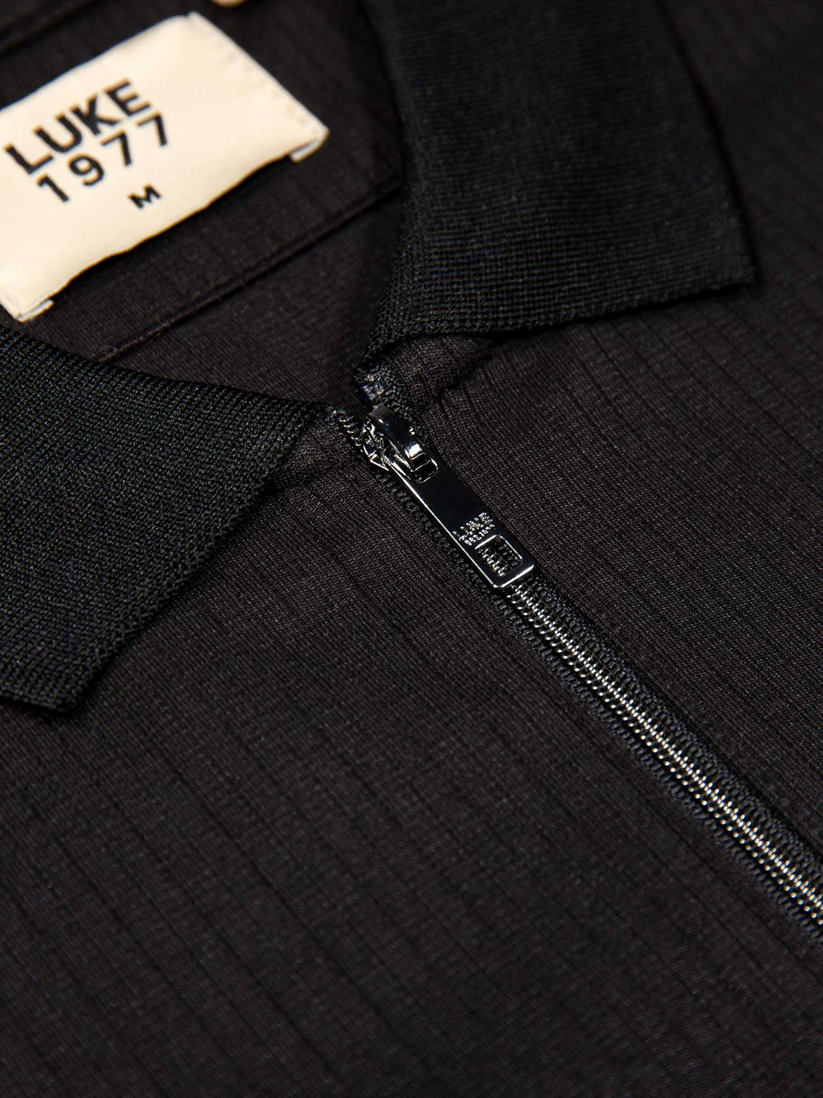 Men's black polo shirt with polo collar, detail view 1