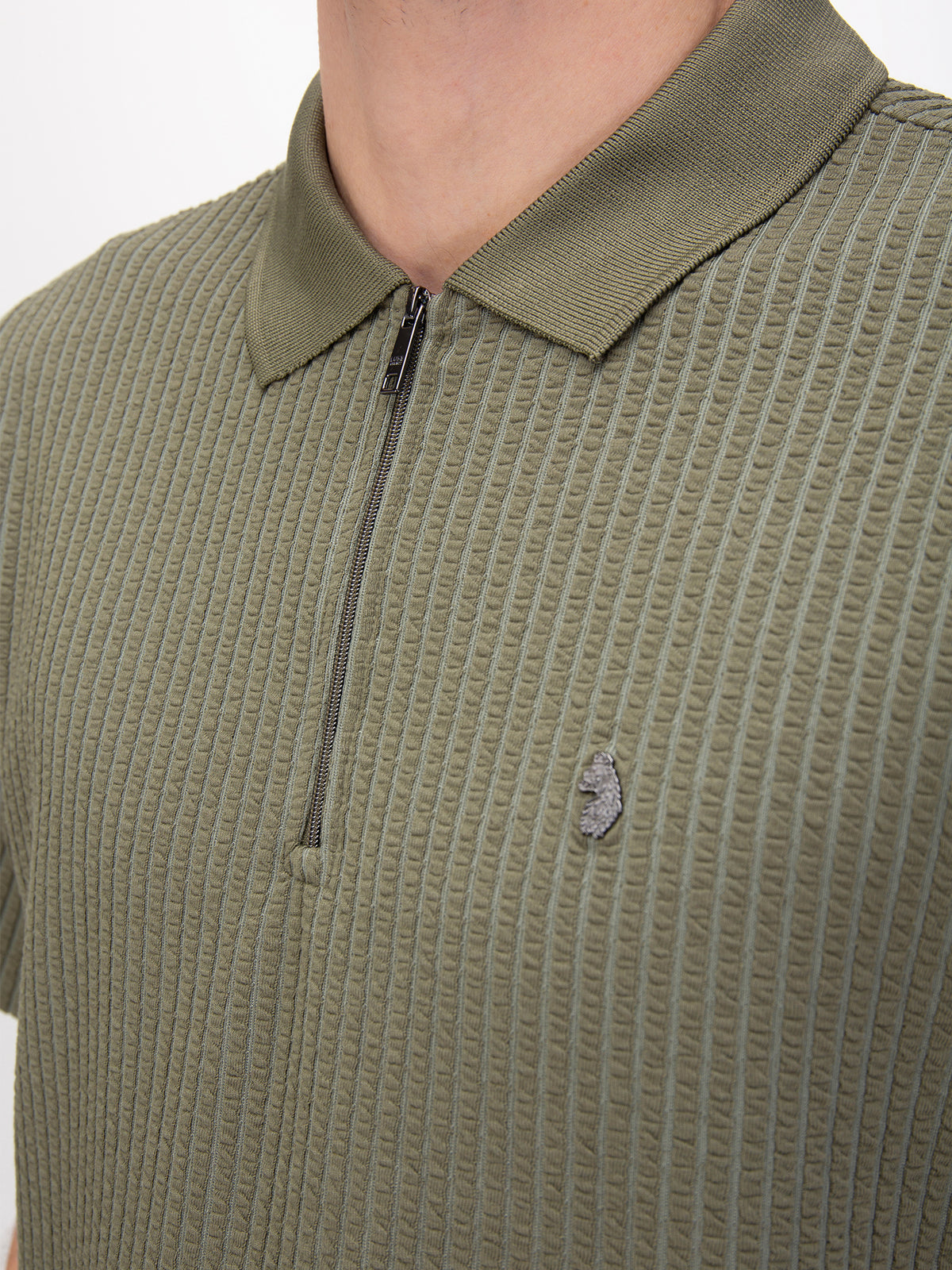 Men's green polo shirt with polo collar, worn by a model