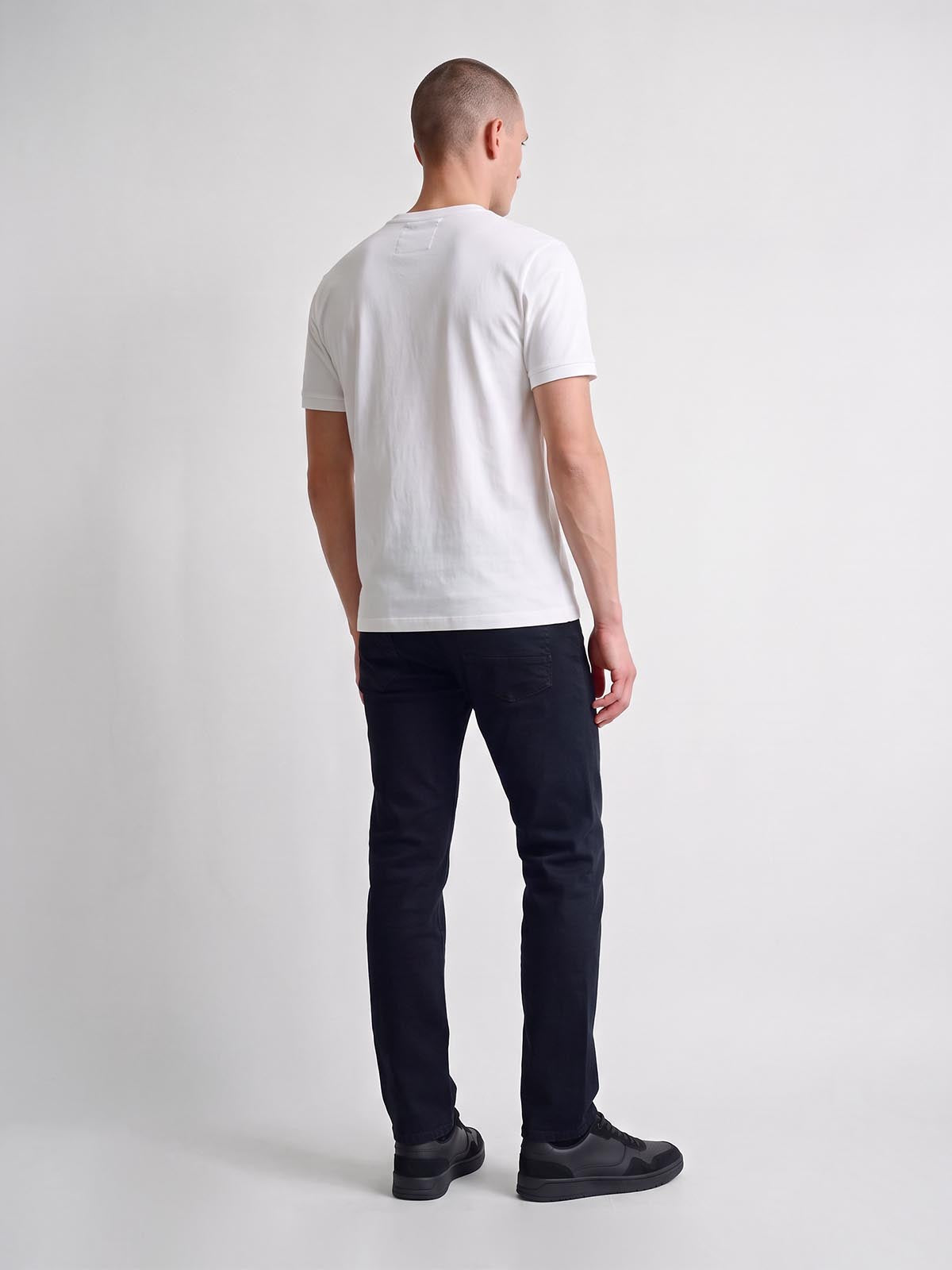 Full length back view of white LUKE 1977 Leo pique t-shirt worn by model
