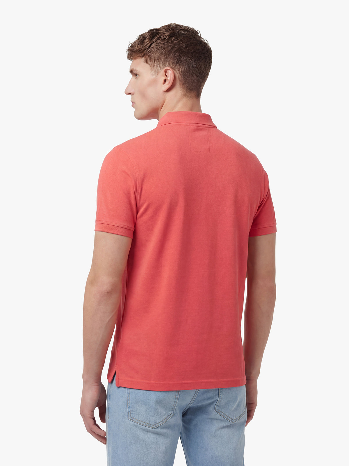 Men's red polo shirt with polo collar, back view