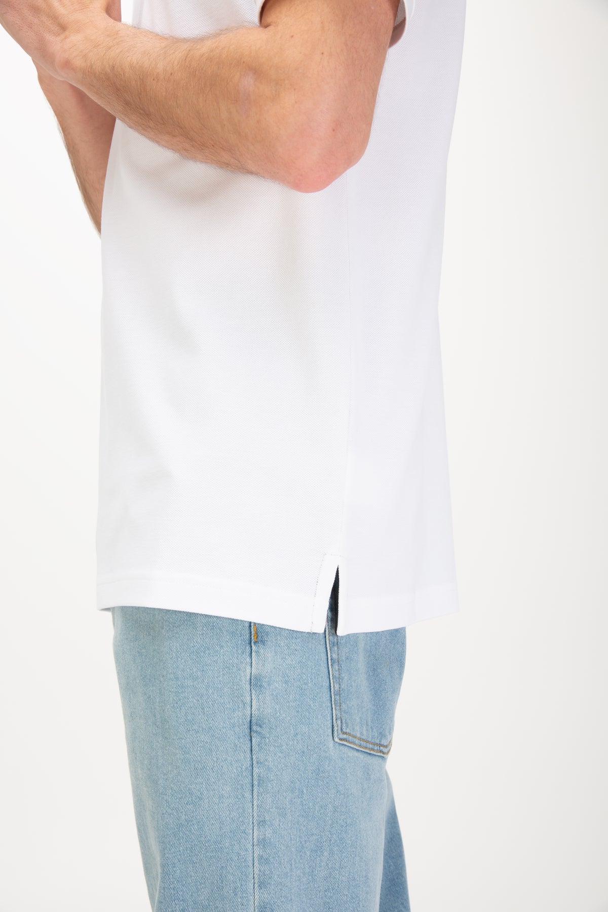 Men's white polo shirt with polo collar, worn by a model