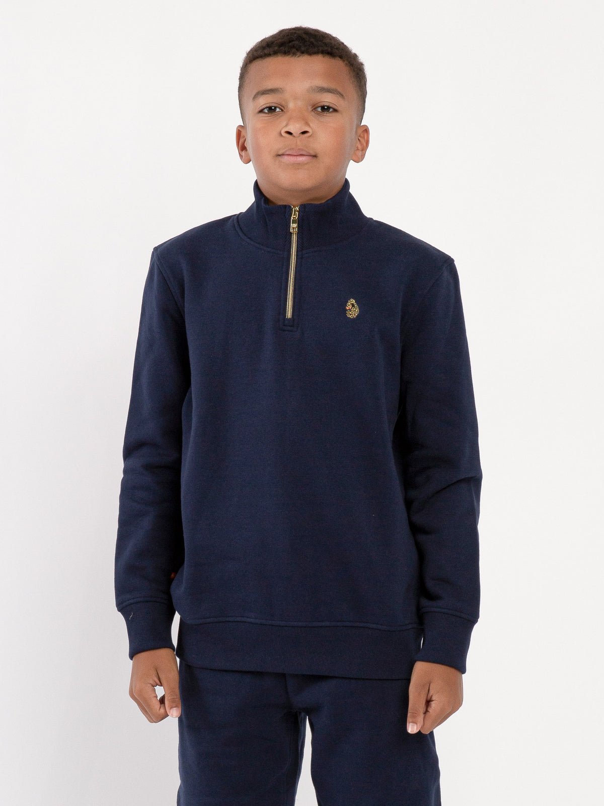 Boy's sweatshirt with quarter-zip and fleece worn by model, front view