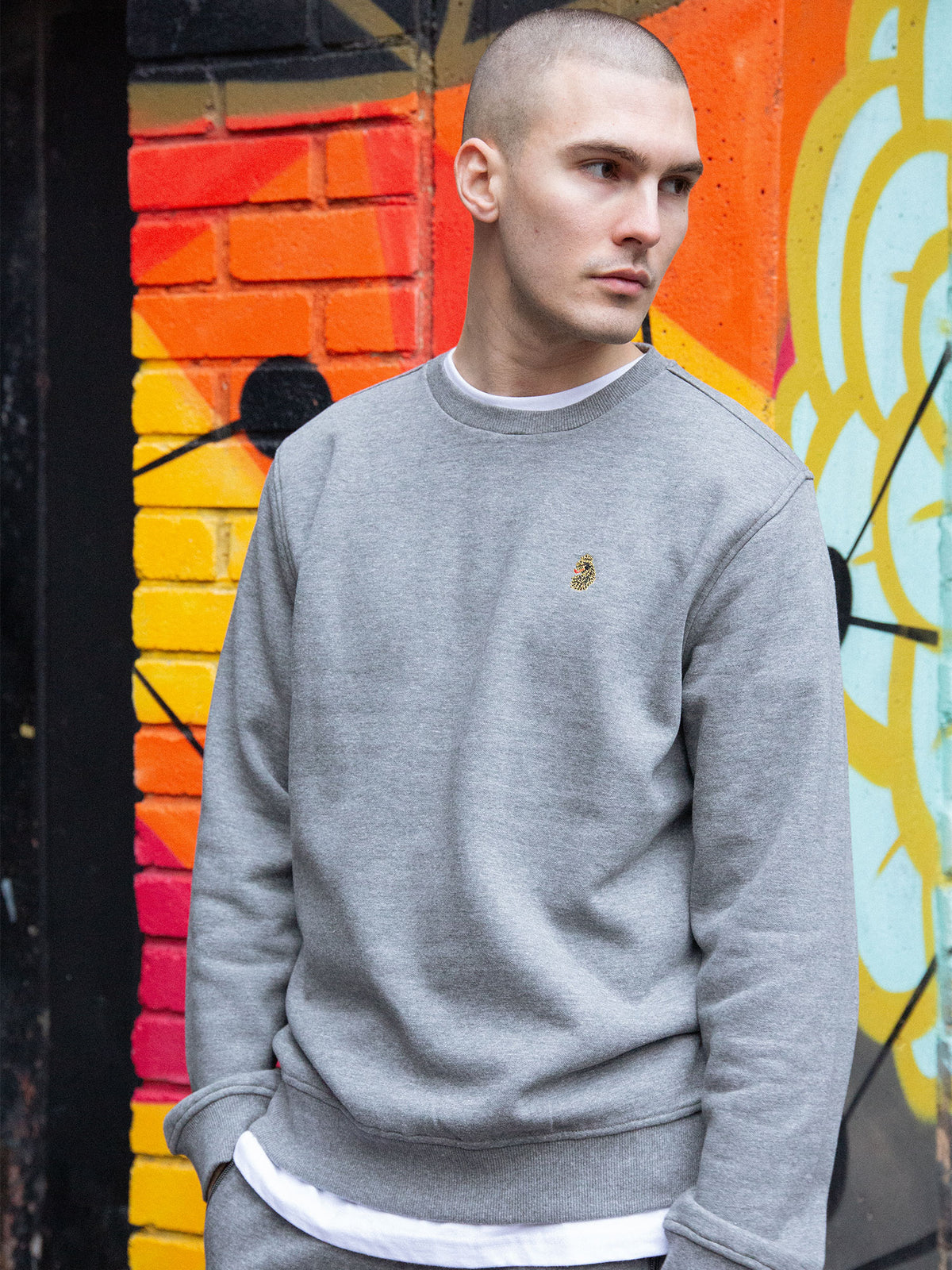 Men's grey tracksuit with crew neck sweatshirt and matching joggers.