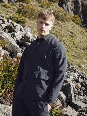 Men's black shirt with button-up front.