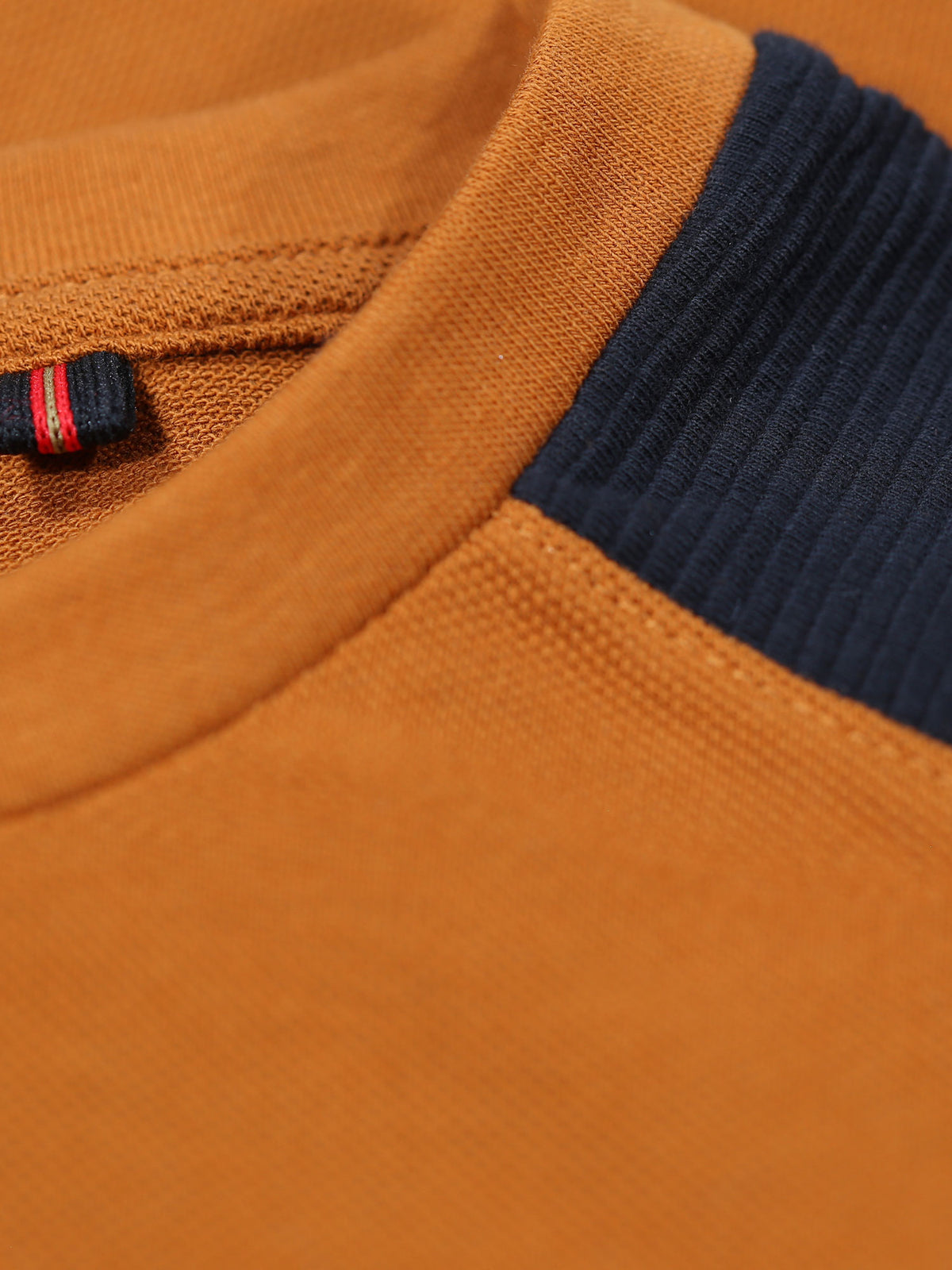 Men's orange t-shirt with crew neck and short sleeves.