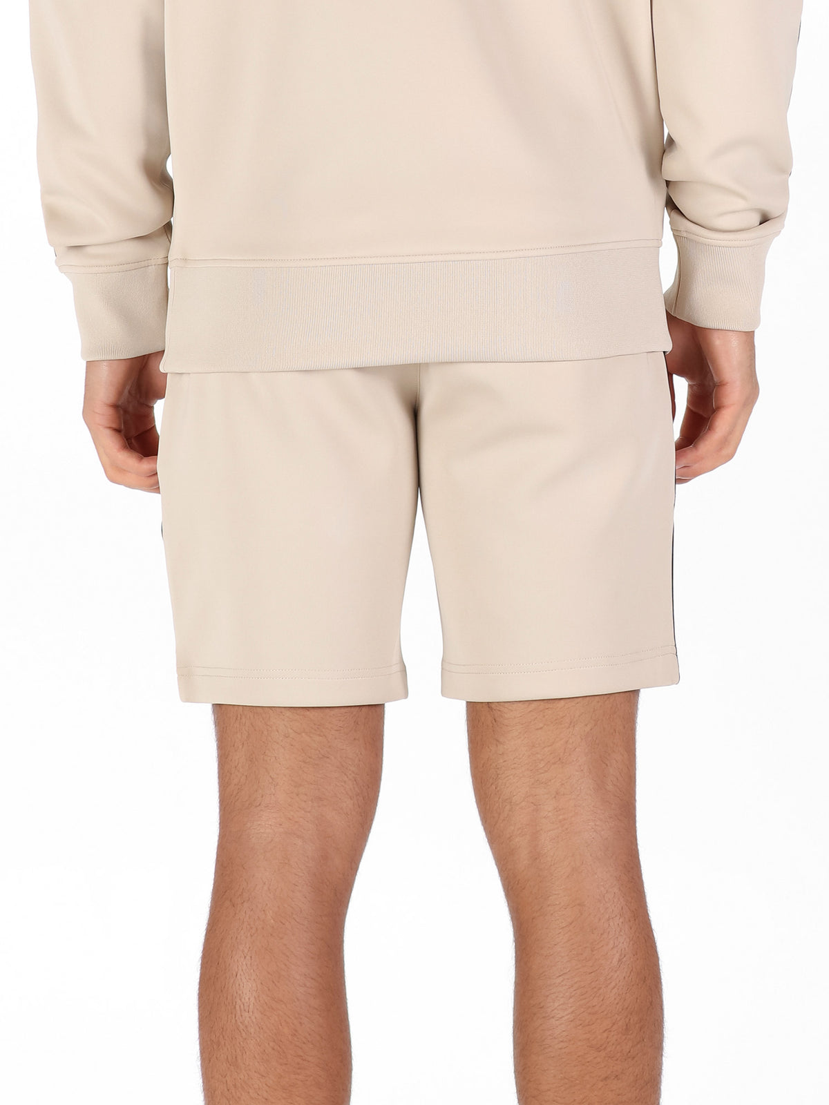 Back view of stone LUKE 1977 TTTST tricot shorts worn by model