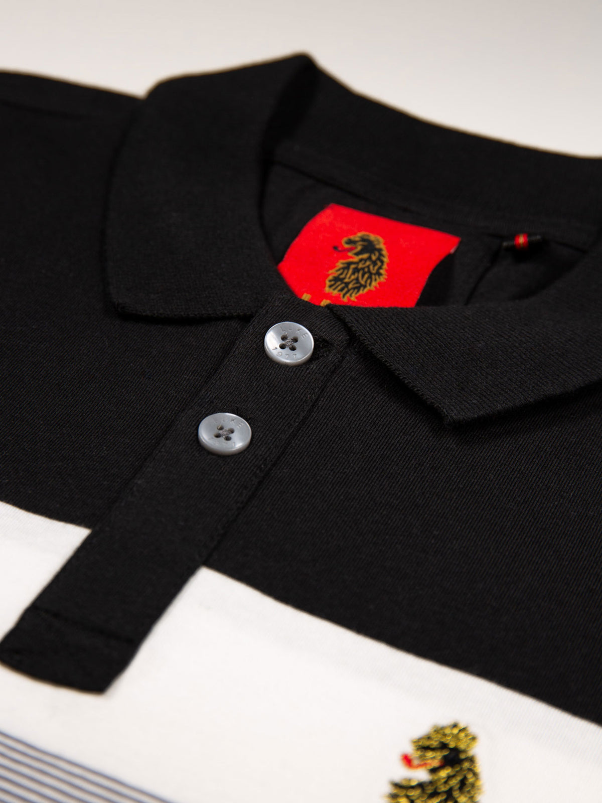 Boy's polo shirt with cotton and striped, button placket detail view