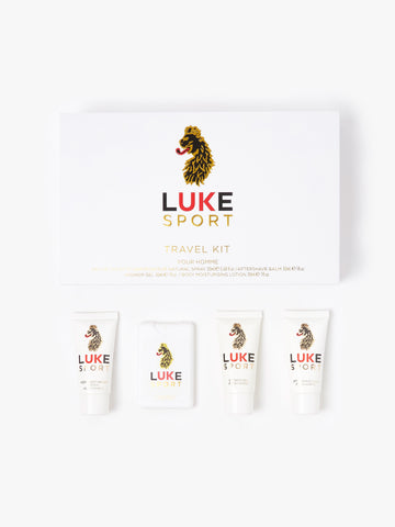LUKE Sport 4 piece travel kit with eau de toilette, aftershave balm, shower gel and body lotion beside its box