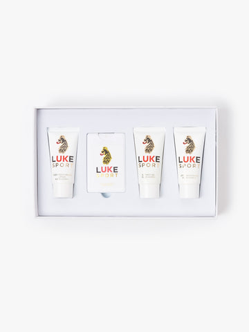 Open box of LUKE Sport 4 piece travel kit showing four travel size products