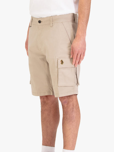 Men's beige shorts with drawstring waistband and cargo pockets, worn by a model, side view