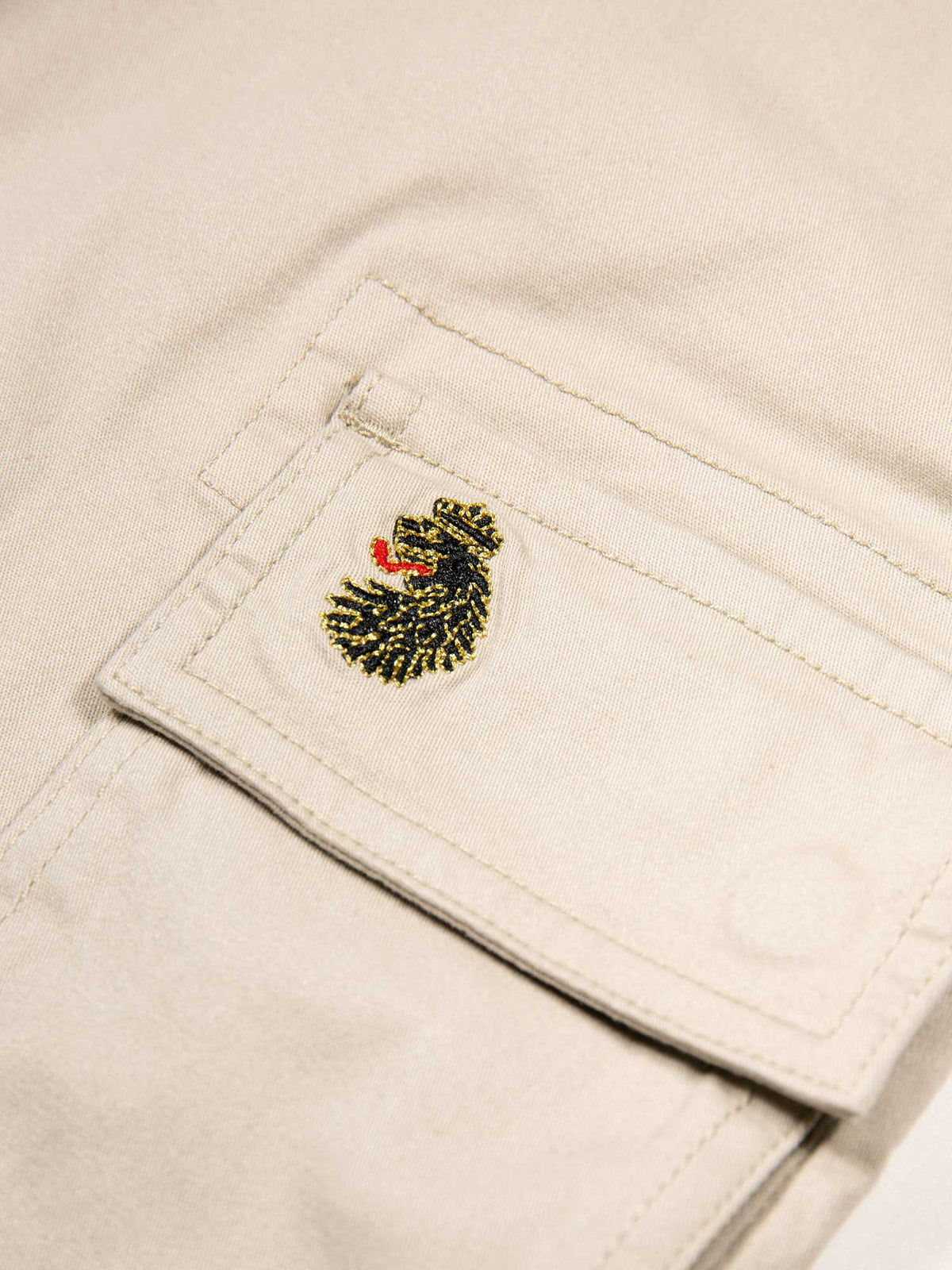 Men's beige shorts with drawstring waistband and cargo pockets.