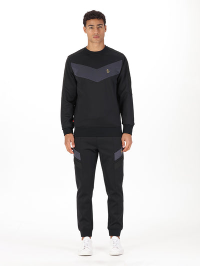 Men's black tracksuit with sweatshirt and matching joggers.