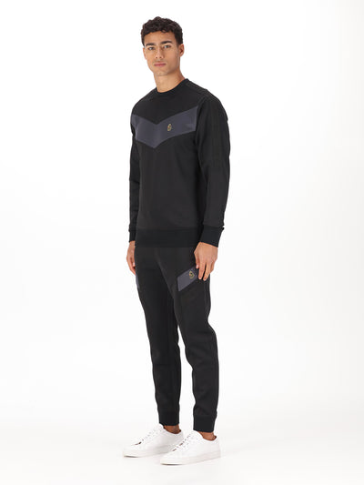 Men's black tracksuit with sweatshirt and matching joggers.