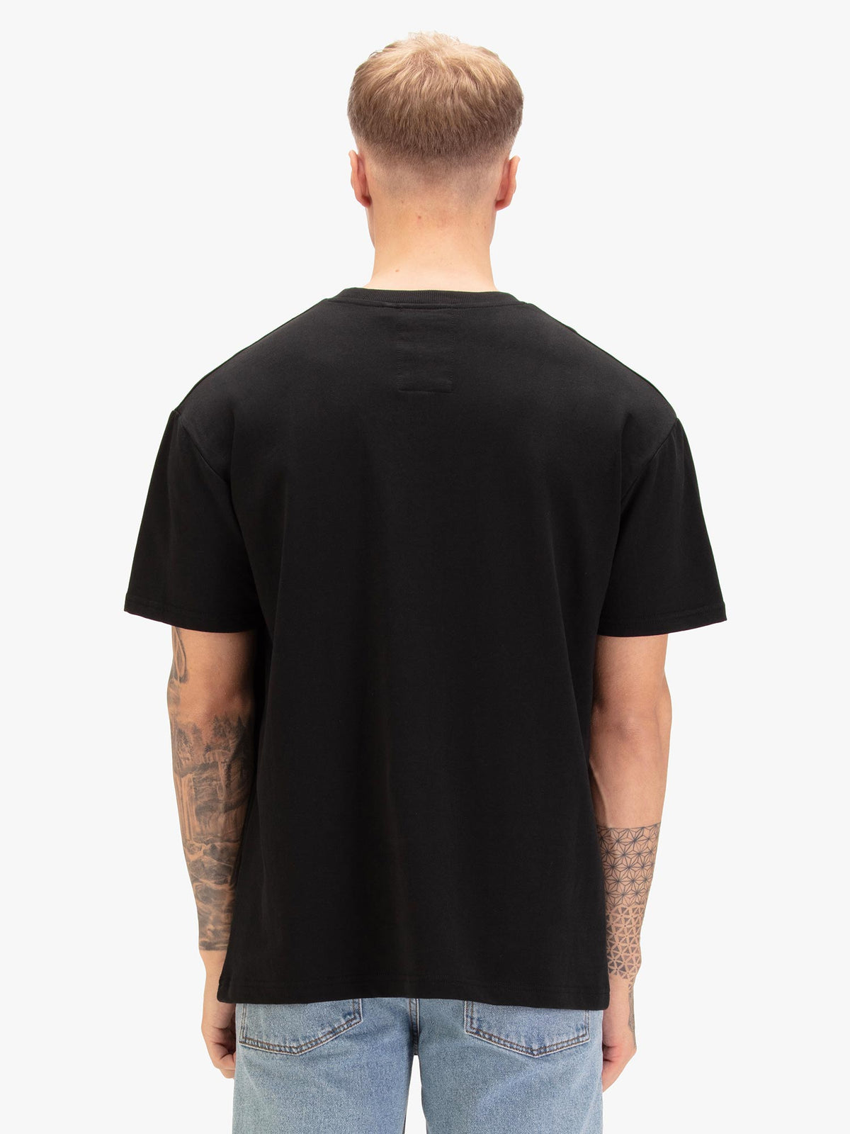 Men's relaxed-fit black t-shirt with crew neck and short sleeves, worn by a model, back view
