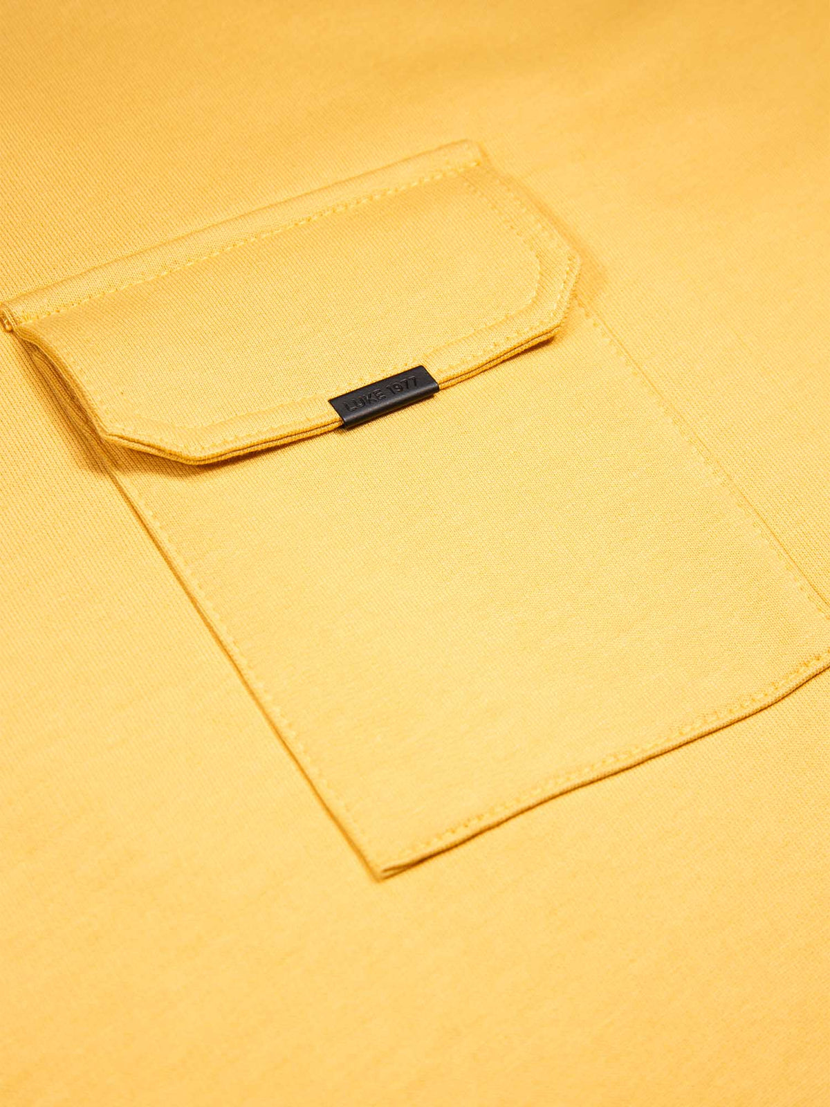 Boy's yellow t-shirt with crew neck and pocket, pocket detail view