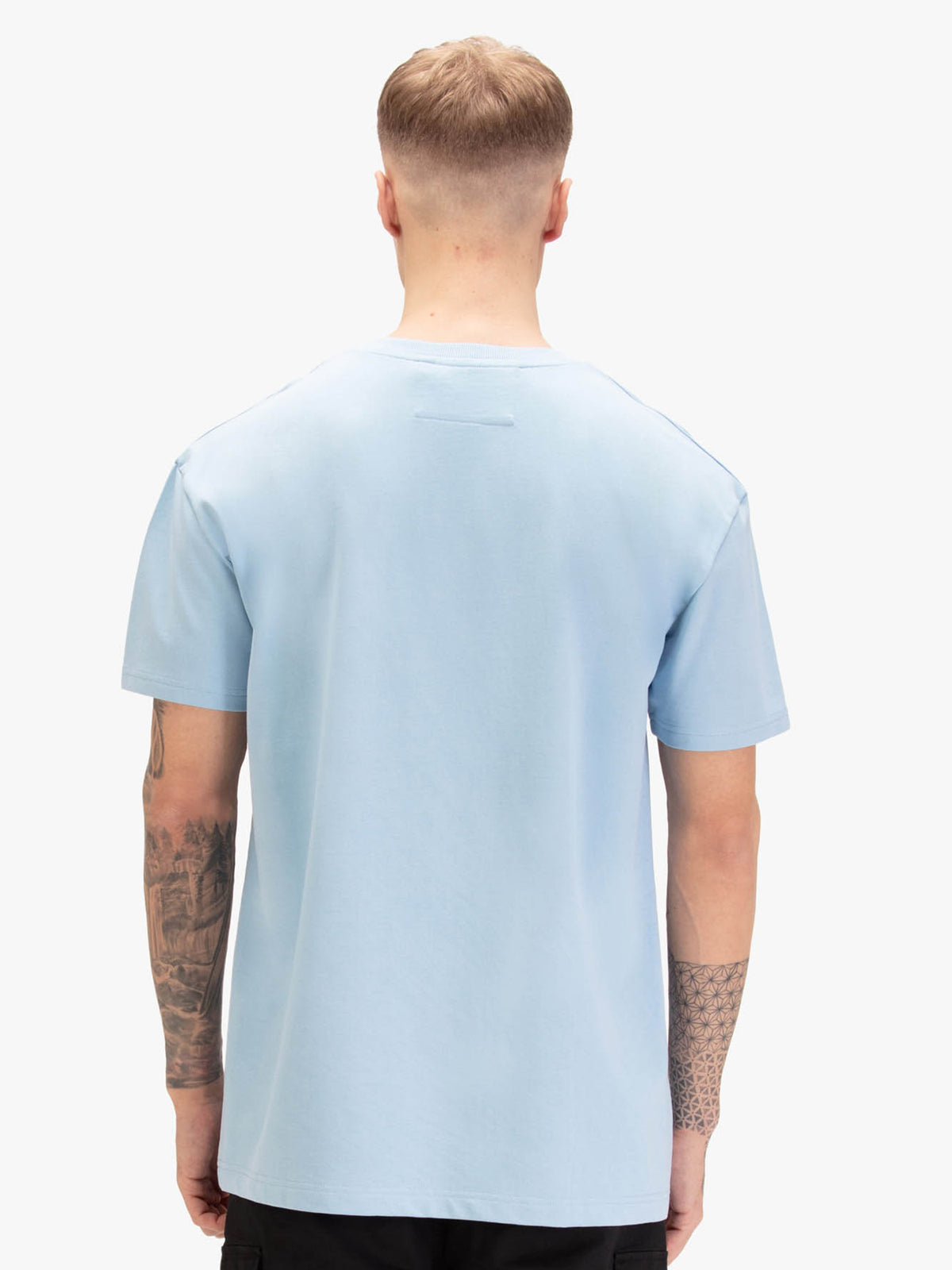 Men's relaxed-fit blue t-shirt with crew neck and short sleeves, worn by a model, back view