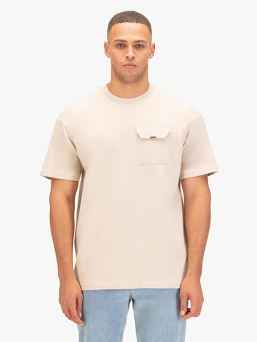 Men's relaxed-fit beige t-shirt with crew neck and short sleeves worn by a model - front view.