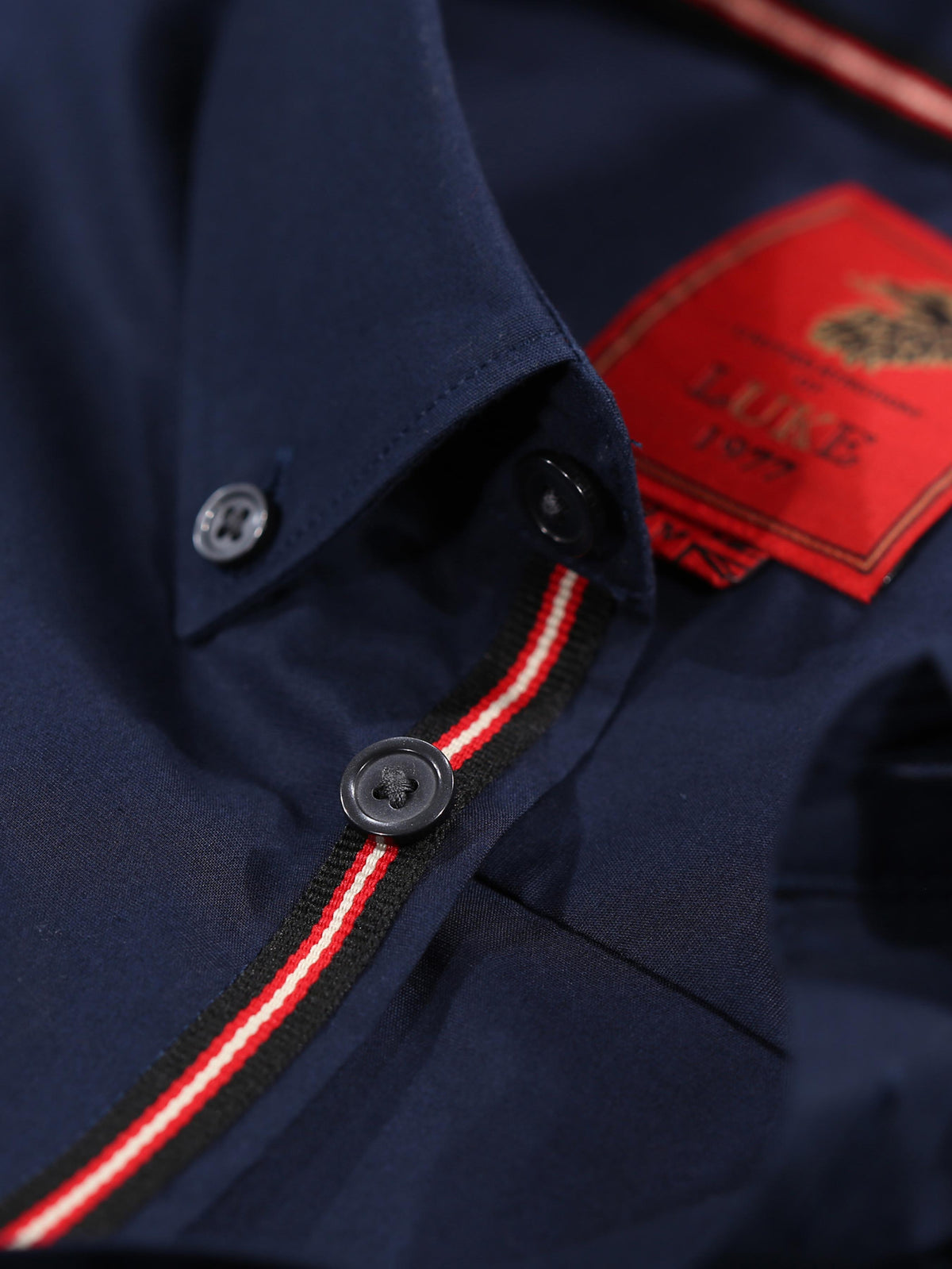 Boy's navy shirt with cotton, buttons detail view