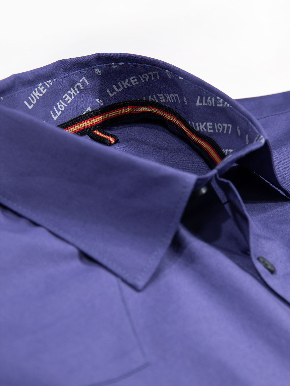 Men's purple shirt with button-up front.