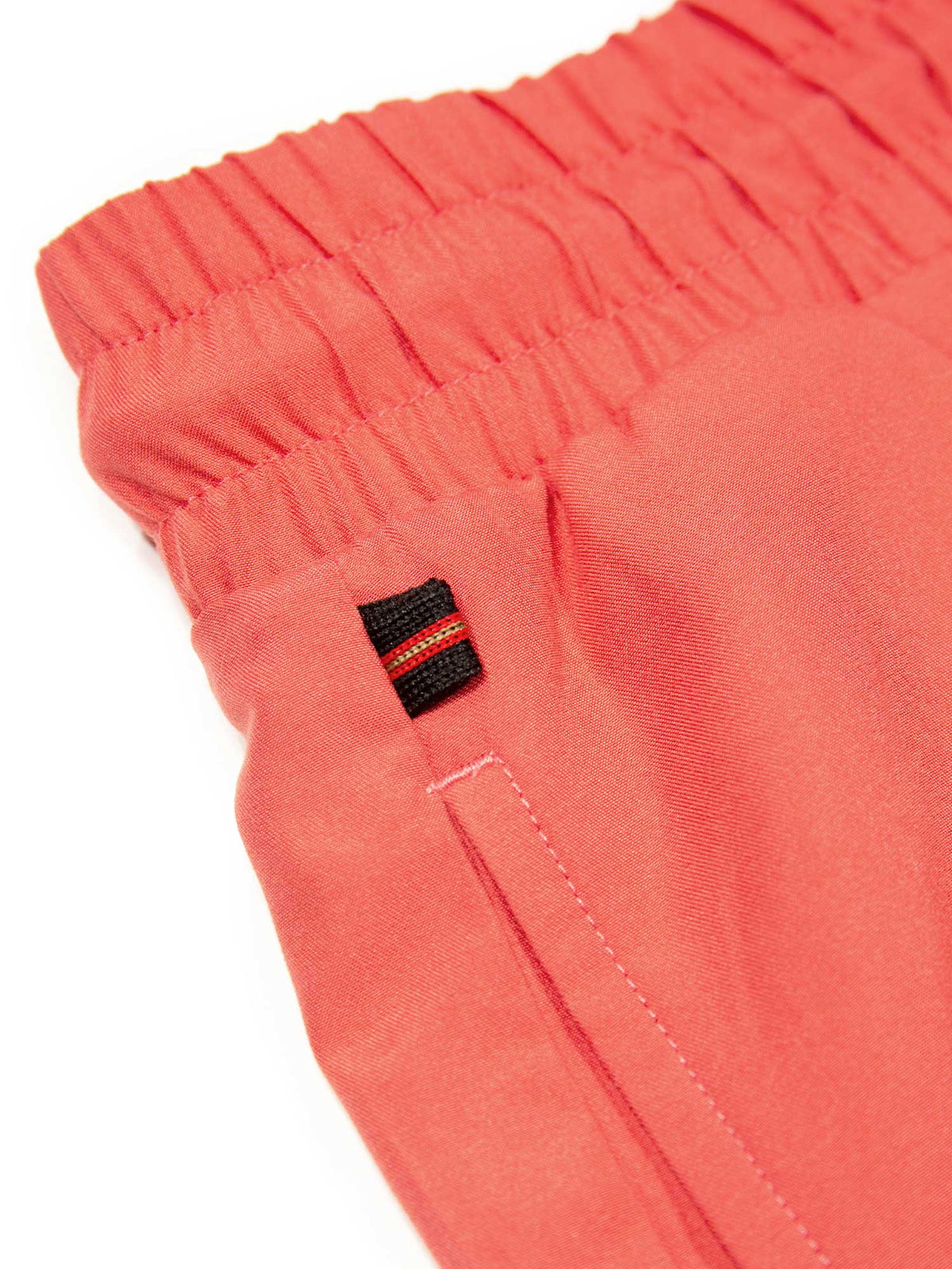 Men's red swim shorts with drawstring waistband, detail view 2