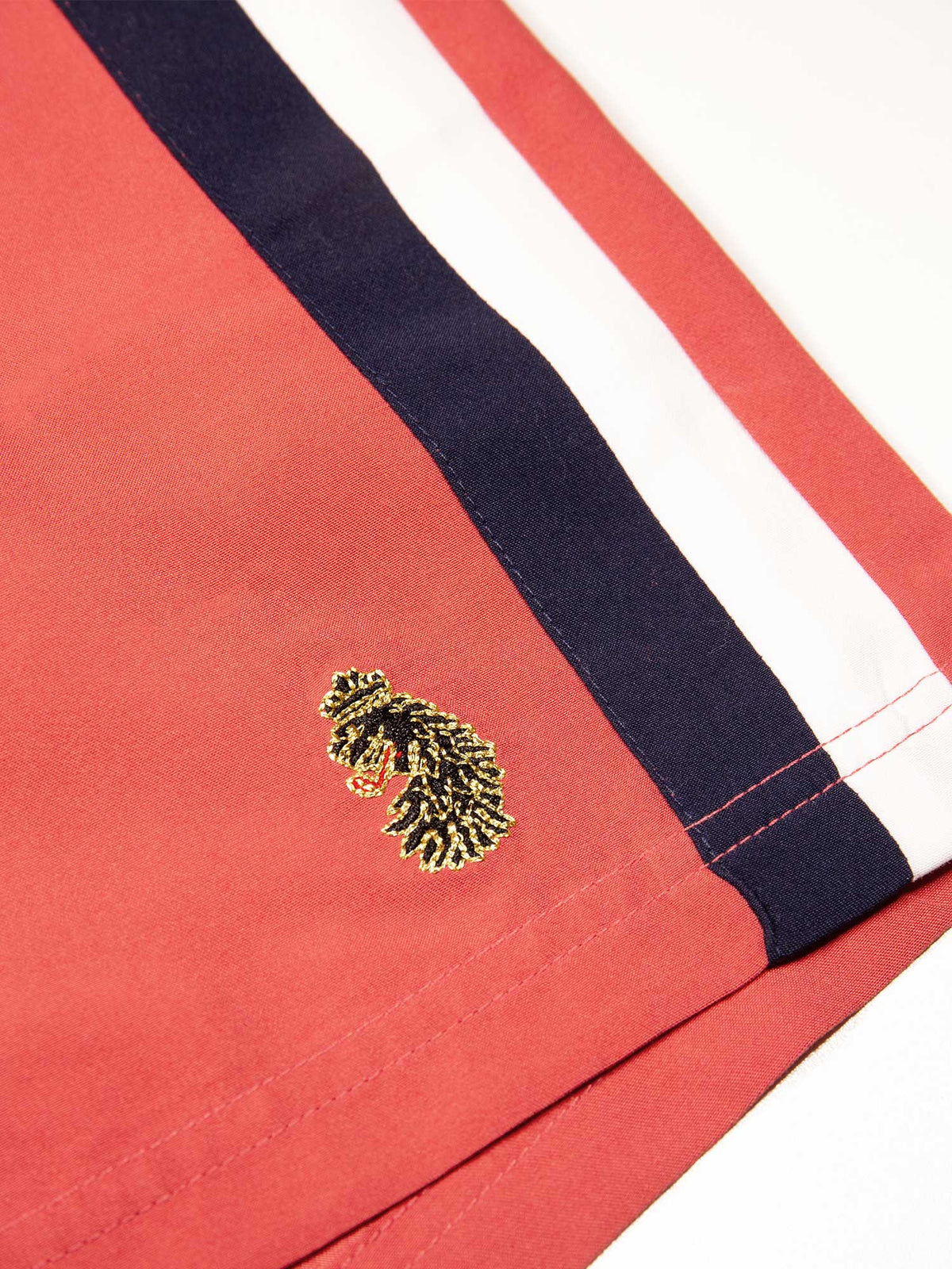 Men's red swim shorts with drawstring waistband, detail view 3