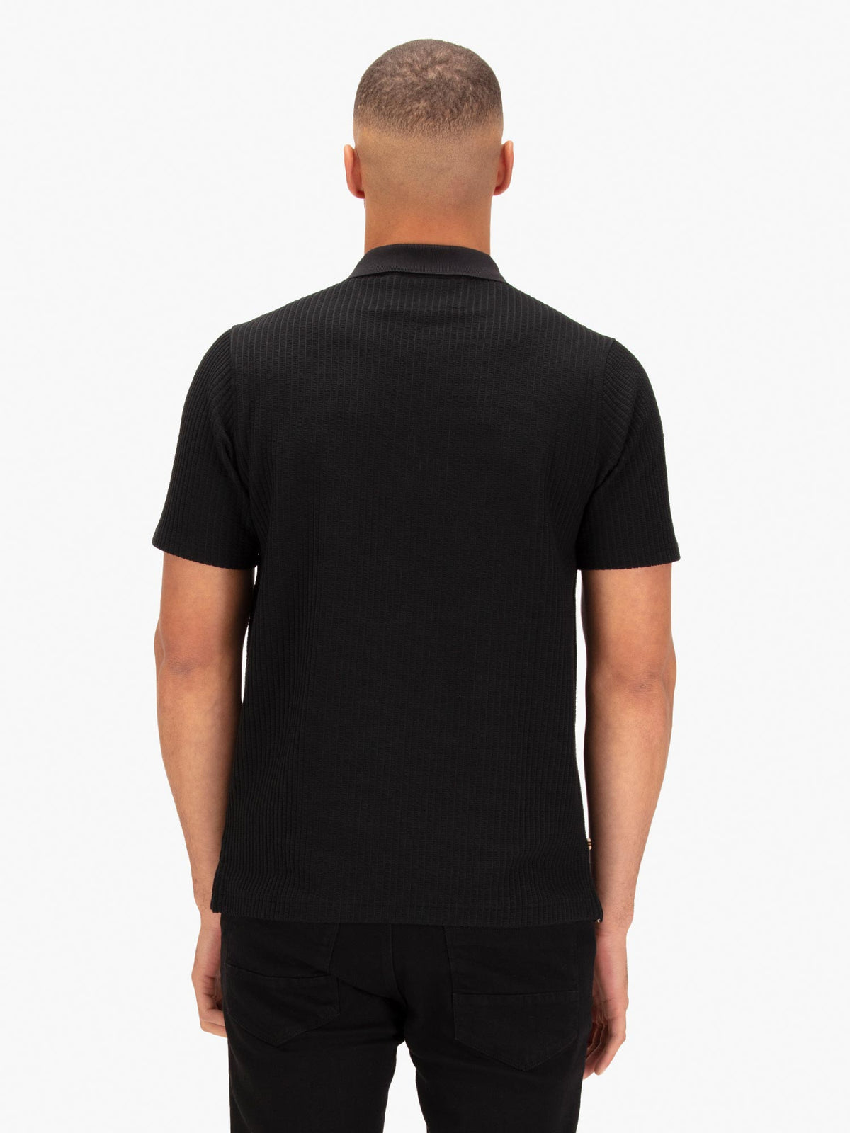Men's black polo shirt with polo collar.