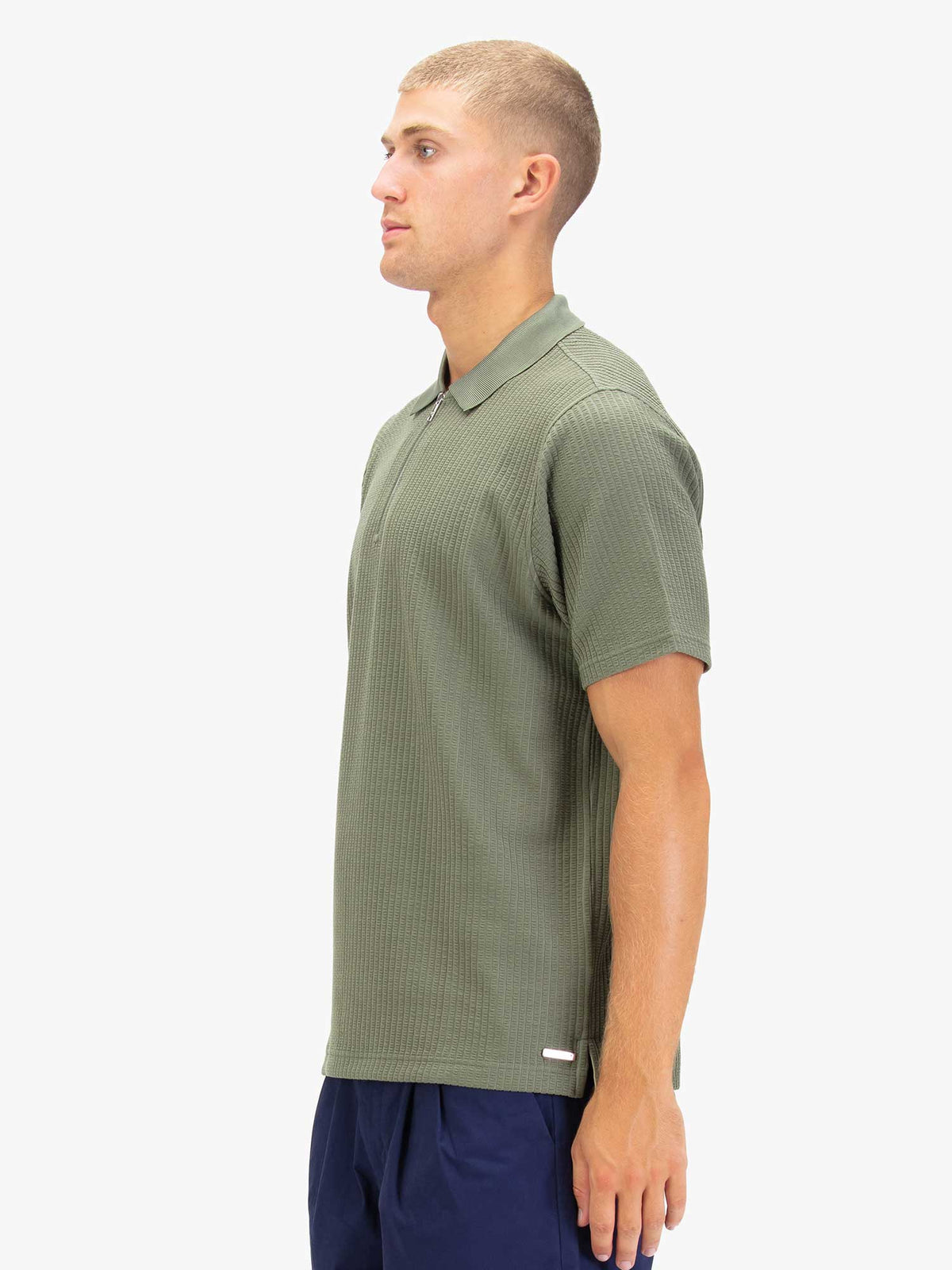 Men's green polo shirt with polo collar.