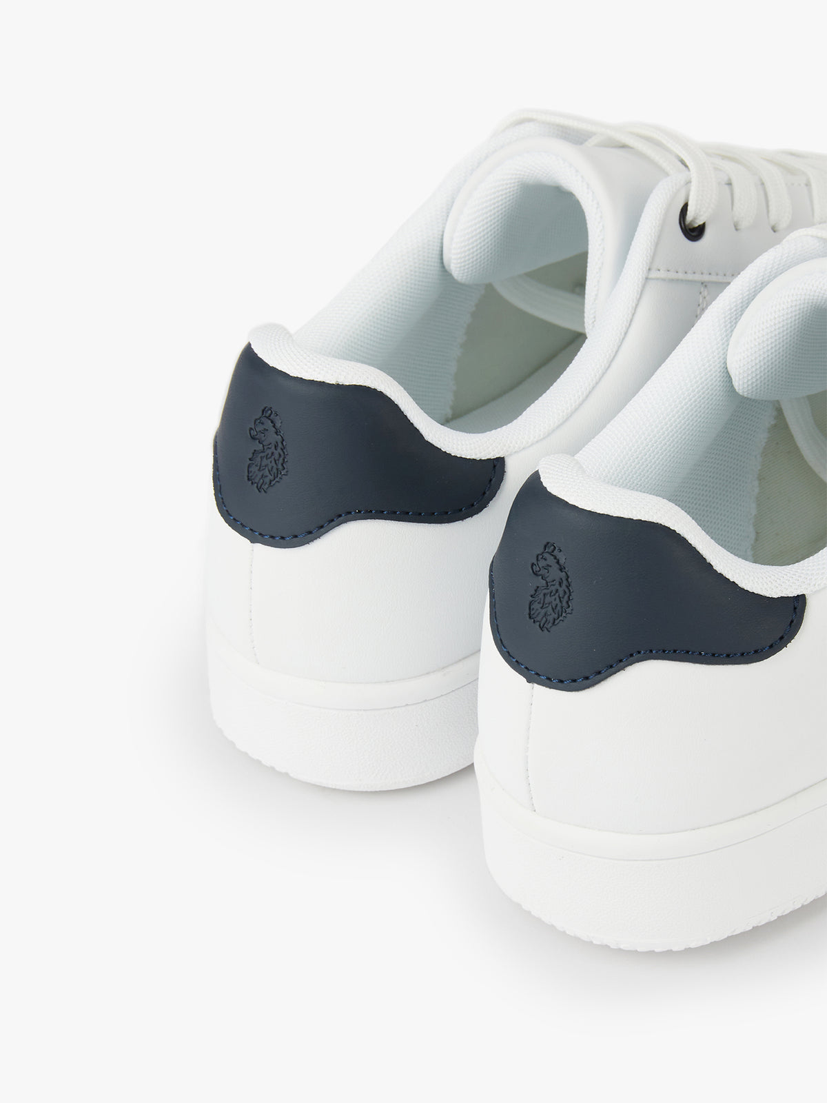 Men's white footwear.