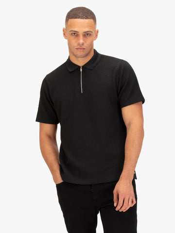 Men's black polo shirt with polo collar.