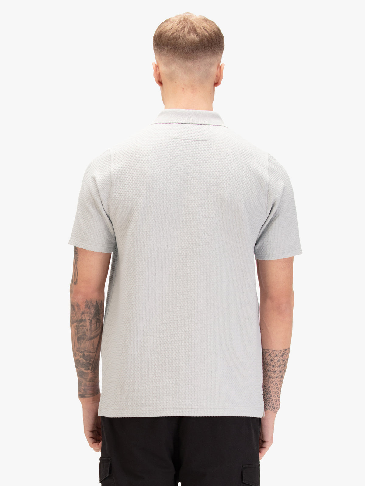 Men's grey polo shirt with polo collar, worn by a model, back view