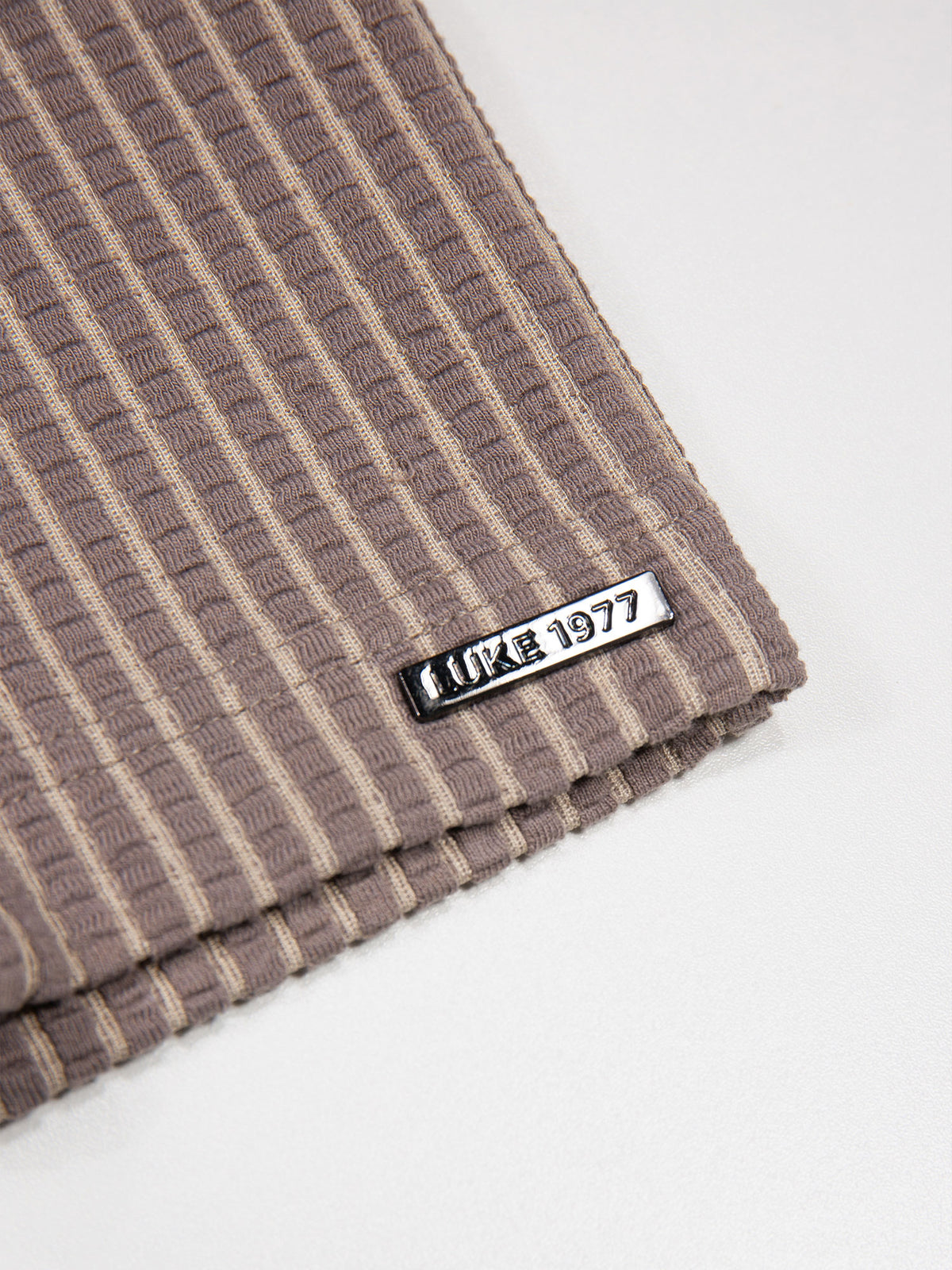 Men's brown polo shirt with polo collar.