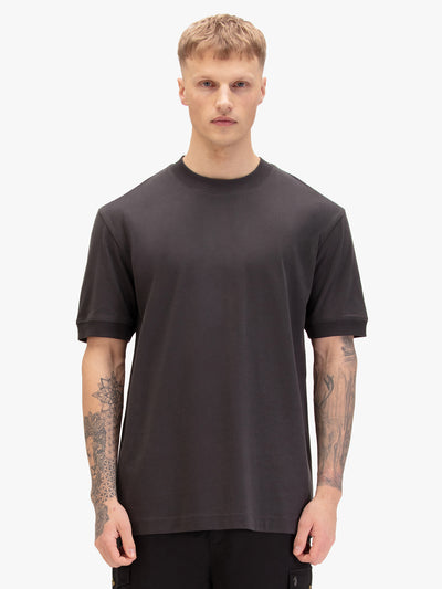 Men's relaxed-fit grey t-shirt with crew neck and short sleeves, worn by a model, front view