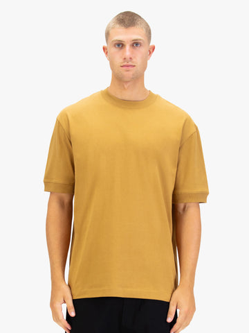 Men's orange t-shirt with crew neck and short sleeves worn by a model - front view.