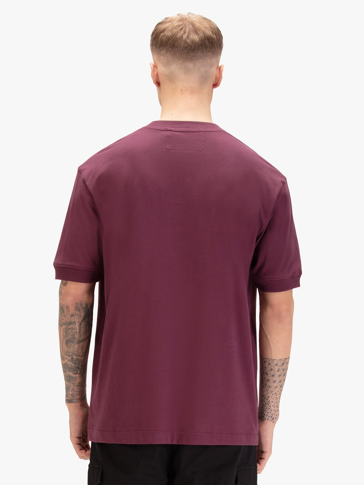 Men's relaxed-fit purple t-shirt with crew neck and short sleeves, worn by a model, back view