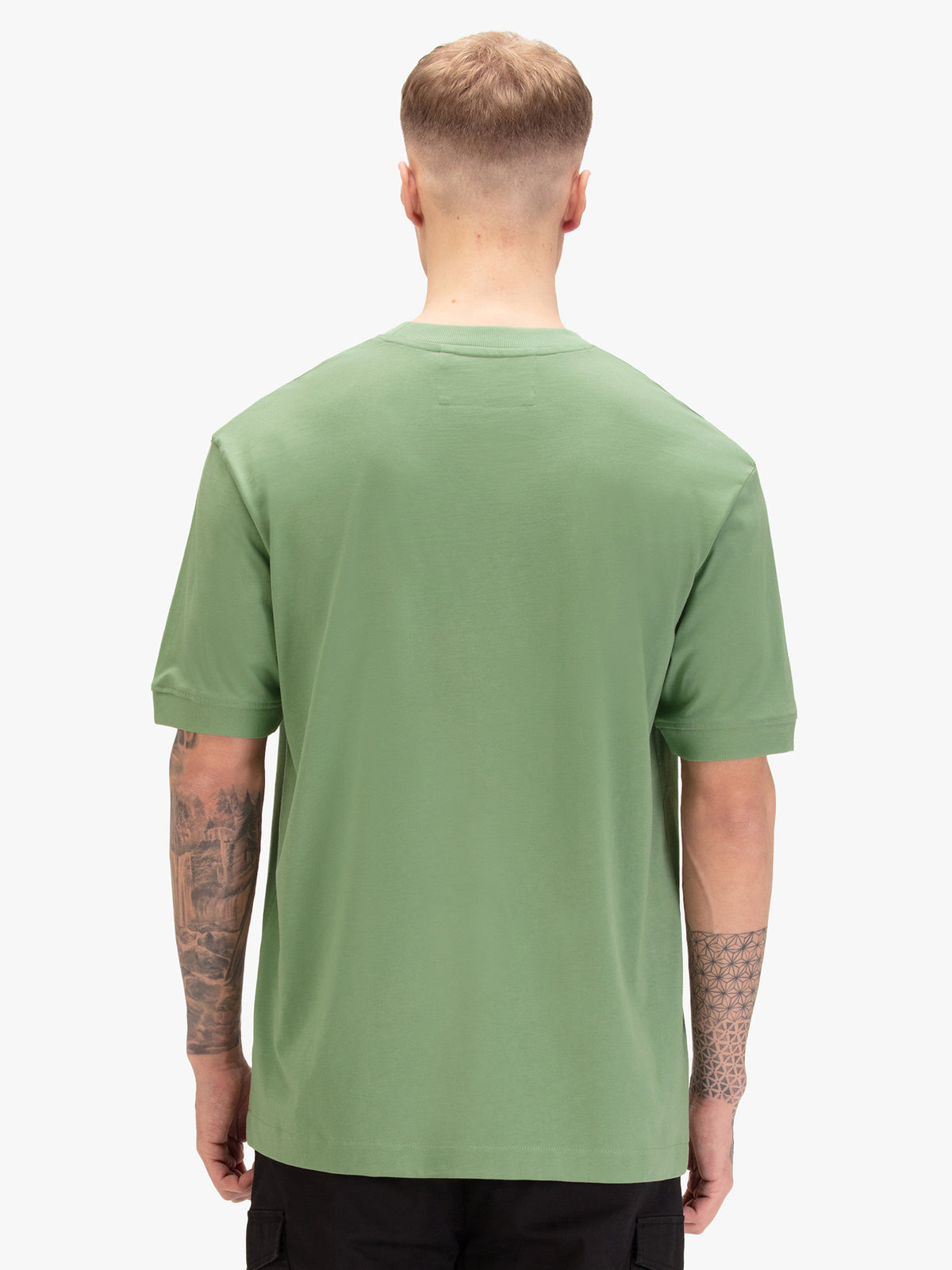 Men's relaxed-fit green t-shirt with crew neck and short sleeves, worn by a model, back view
